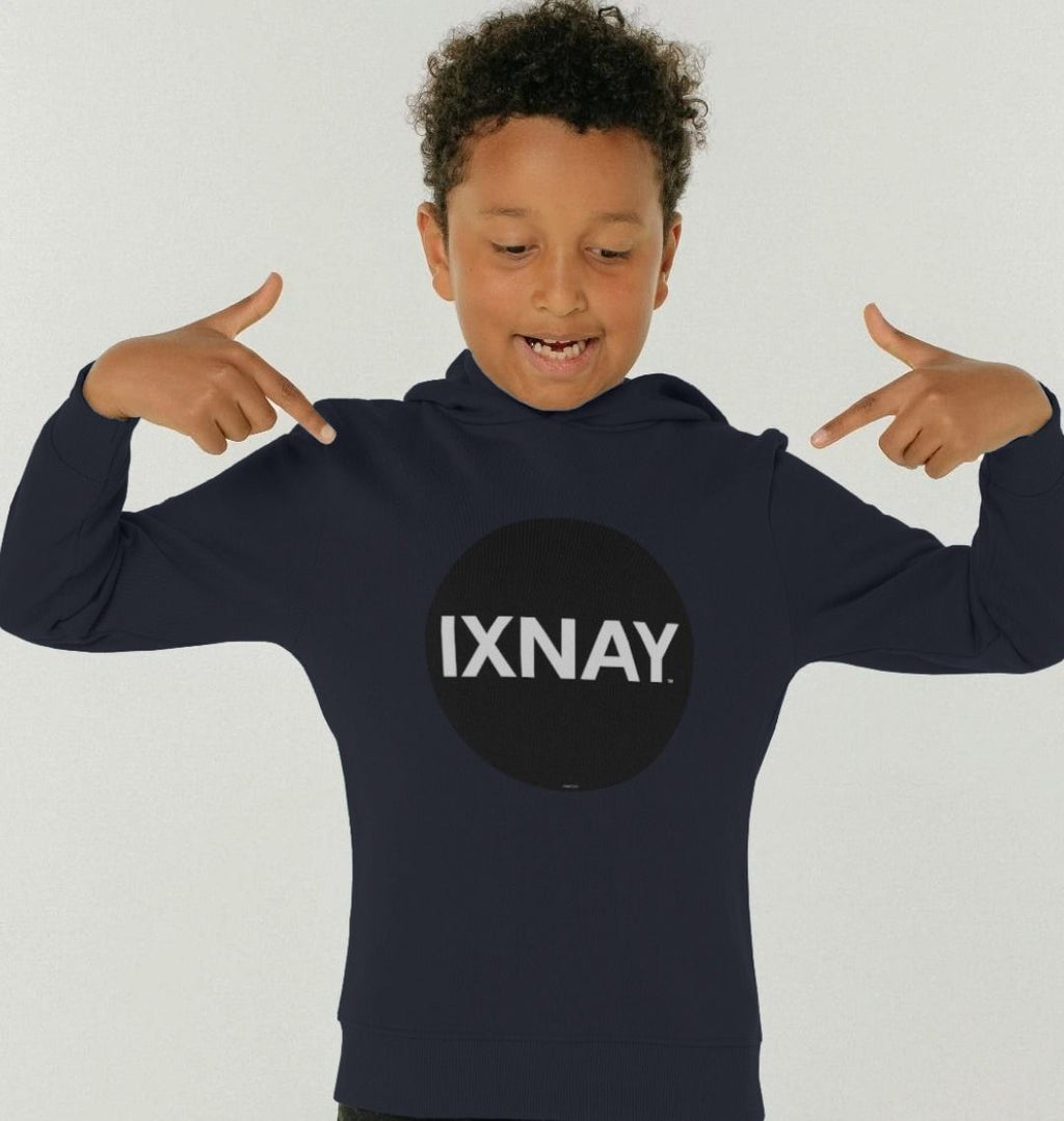 boy in front of white backdrop wearing kids navy blue organic relaxed fit pullover hoodie with original black round IXNAY logo