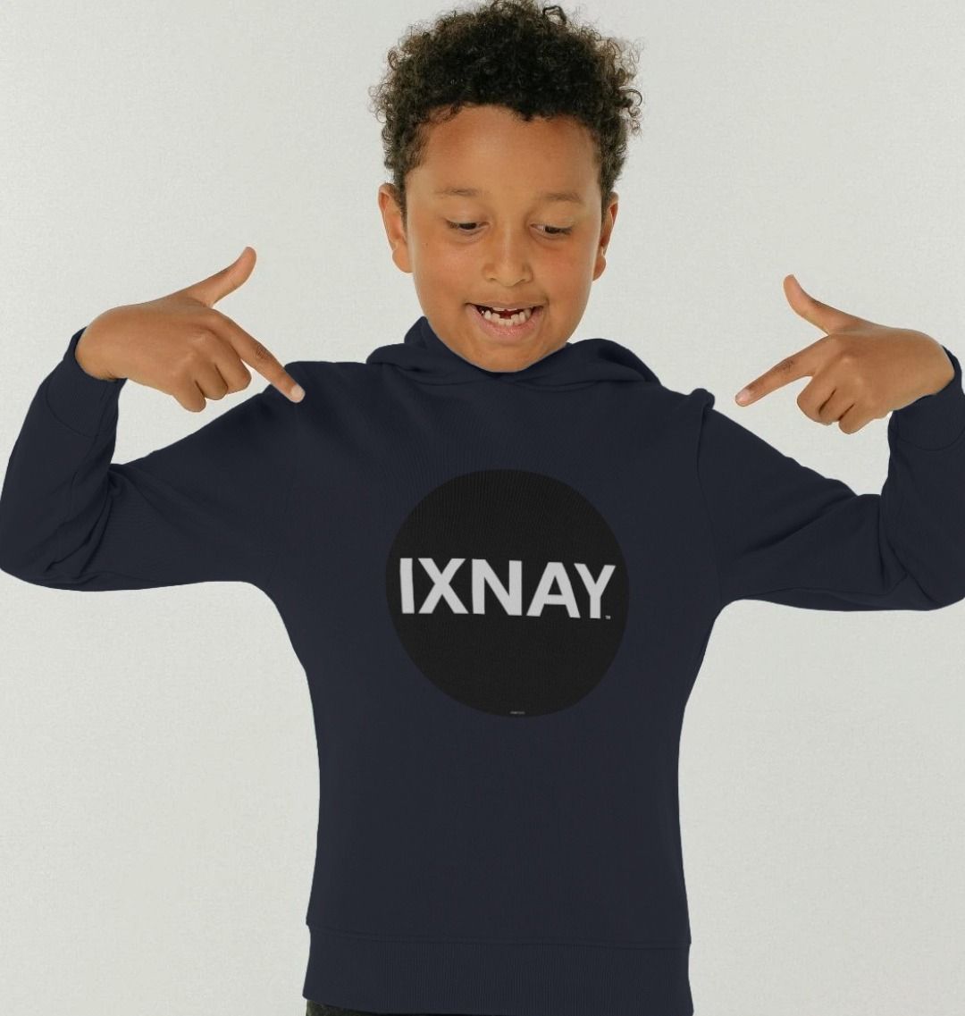 boy in front of white backdrop wearing kids navy blue organic relaxed fit pullover hoodie with original black round IXNAY logo
