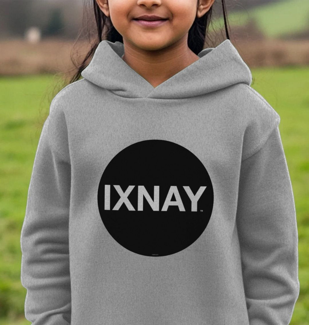 Girl standing in field wearing kids light gray heather organic relaxed fit pullover hoodie with original black round IXNAY logo