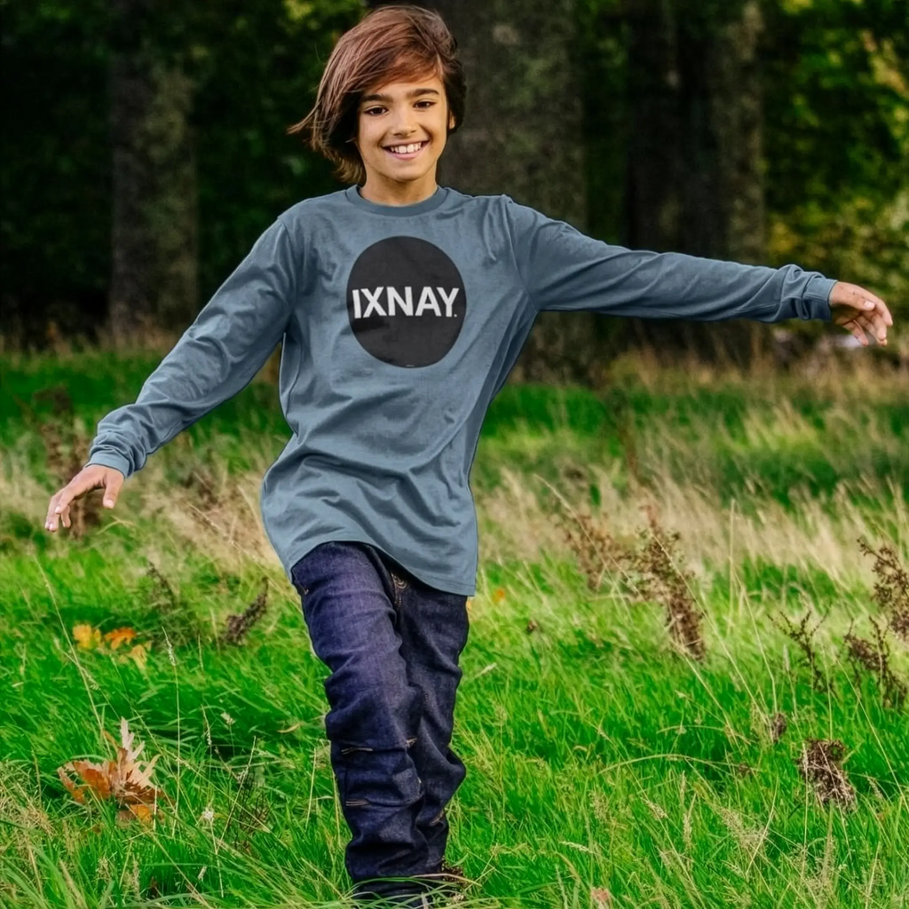 Kid plays wearing IXNAY Kids 100% Organic Cotton Long-Sleeve T-Shirt Original Logo - Stone Blue.
