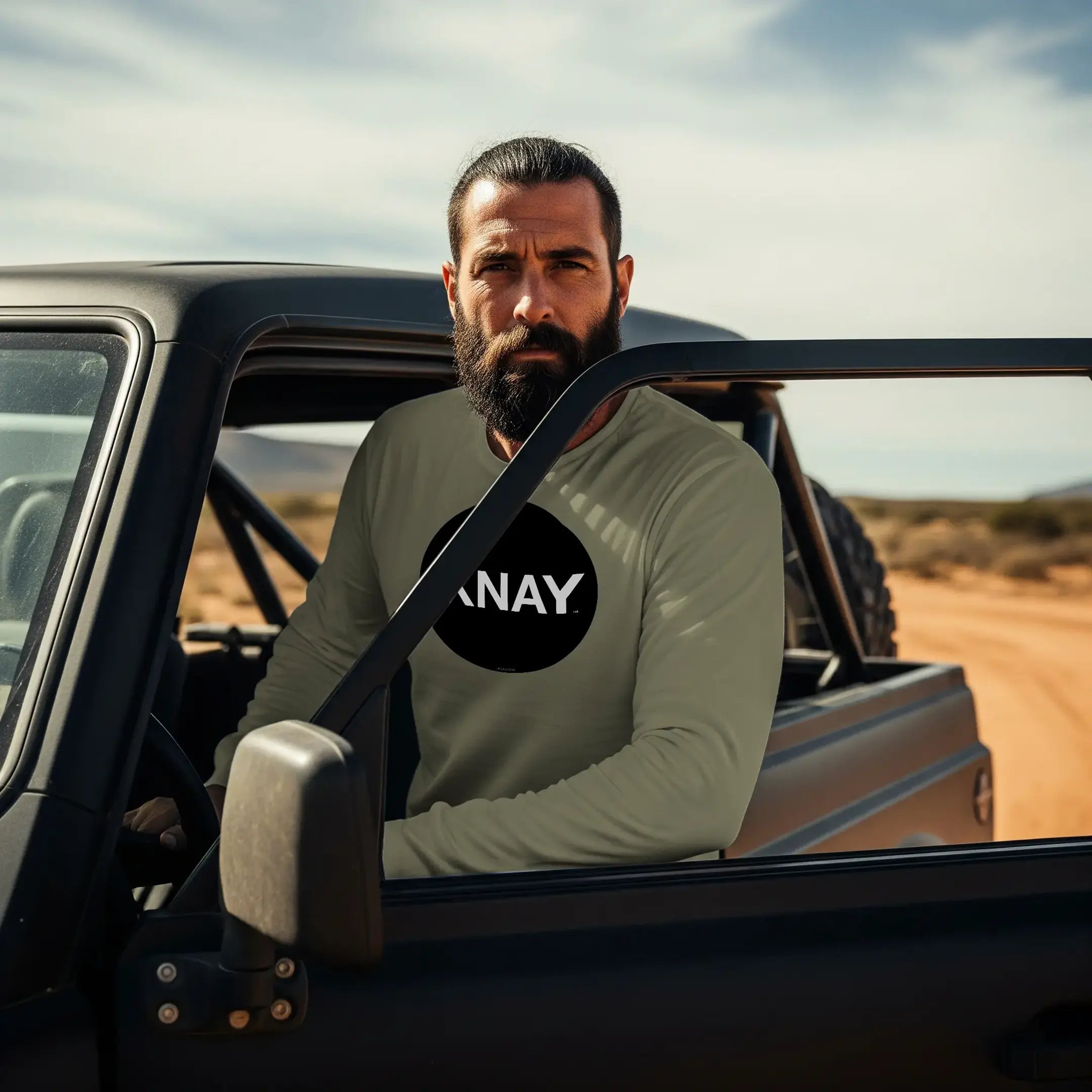man exits black SUV wearing IXNAY original logo mens unisex army green long-sleeved t-shirt front, 100% cotton, high quality