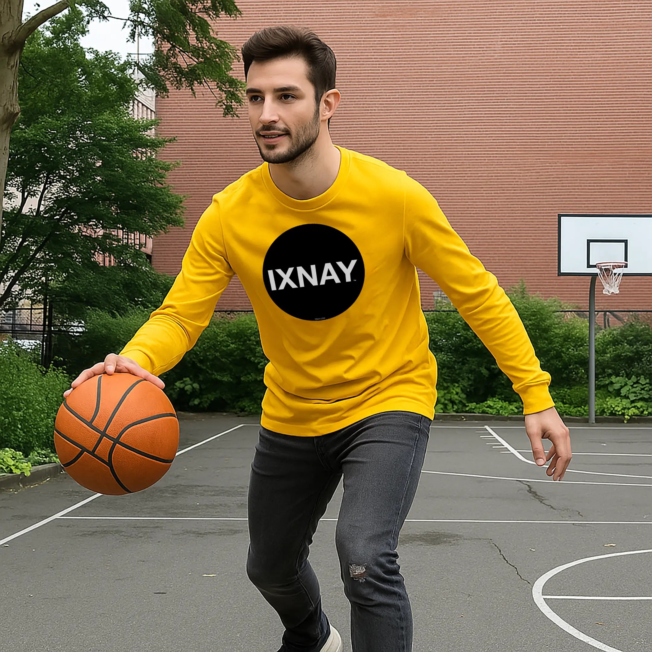man playing basketball wearing IXNAY original logo mens unisex gold yellow long-sleeved t-shirt front, 100% cotton
