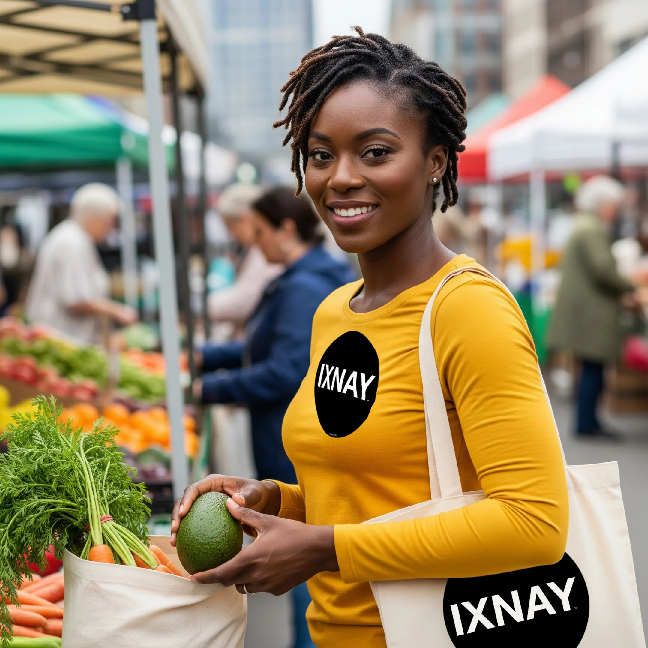 hip black woman farmers market wearing IXNAY original logo mens unisex gold yellow long-sleeved t-shirt front, 100% cotton