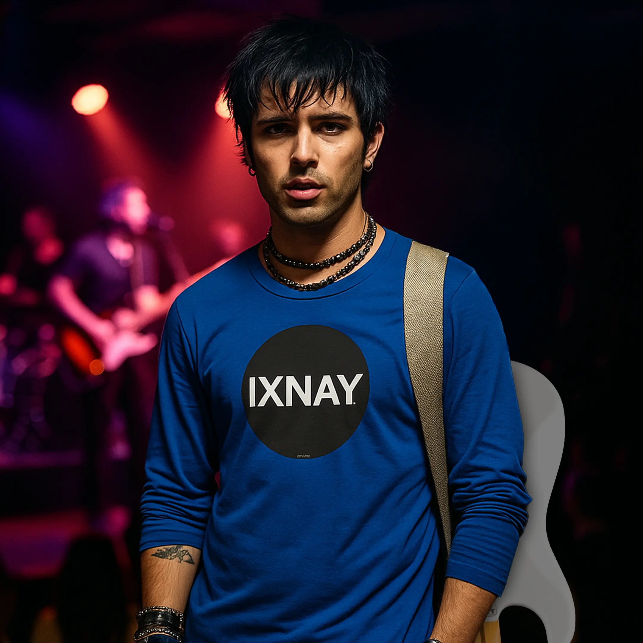 young guitar player exiting night club stage wearing royal blue IXNAY Original Logo 100% cotton long-sleeved t-shirt