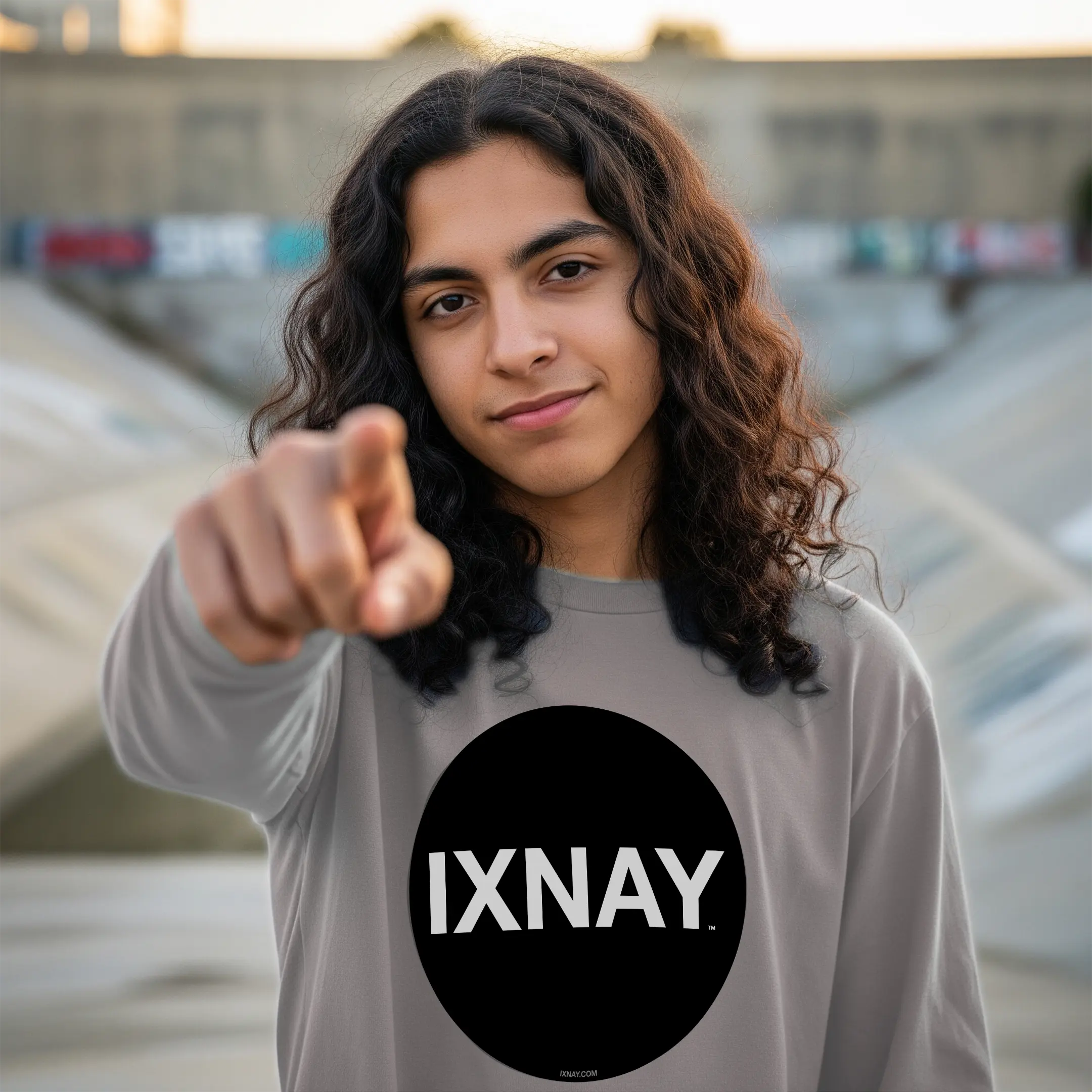 young urban man wearing IXNAY original logo mens unisex storm gray long-sleeved t-shirt front, 100% cotton, high quality