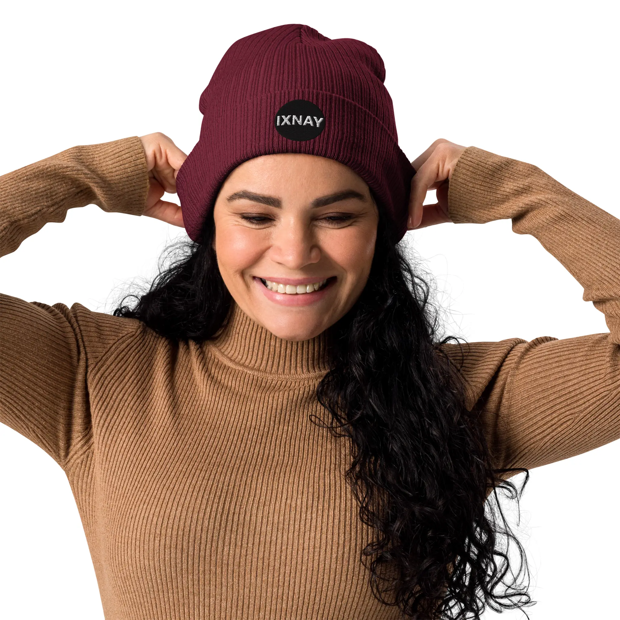 Woman having the best time of her life wearing the IXNAY Original Logo 100% organic ribbed beanie in burgundy red