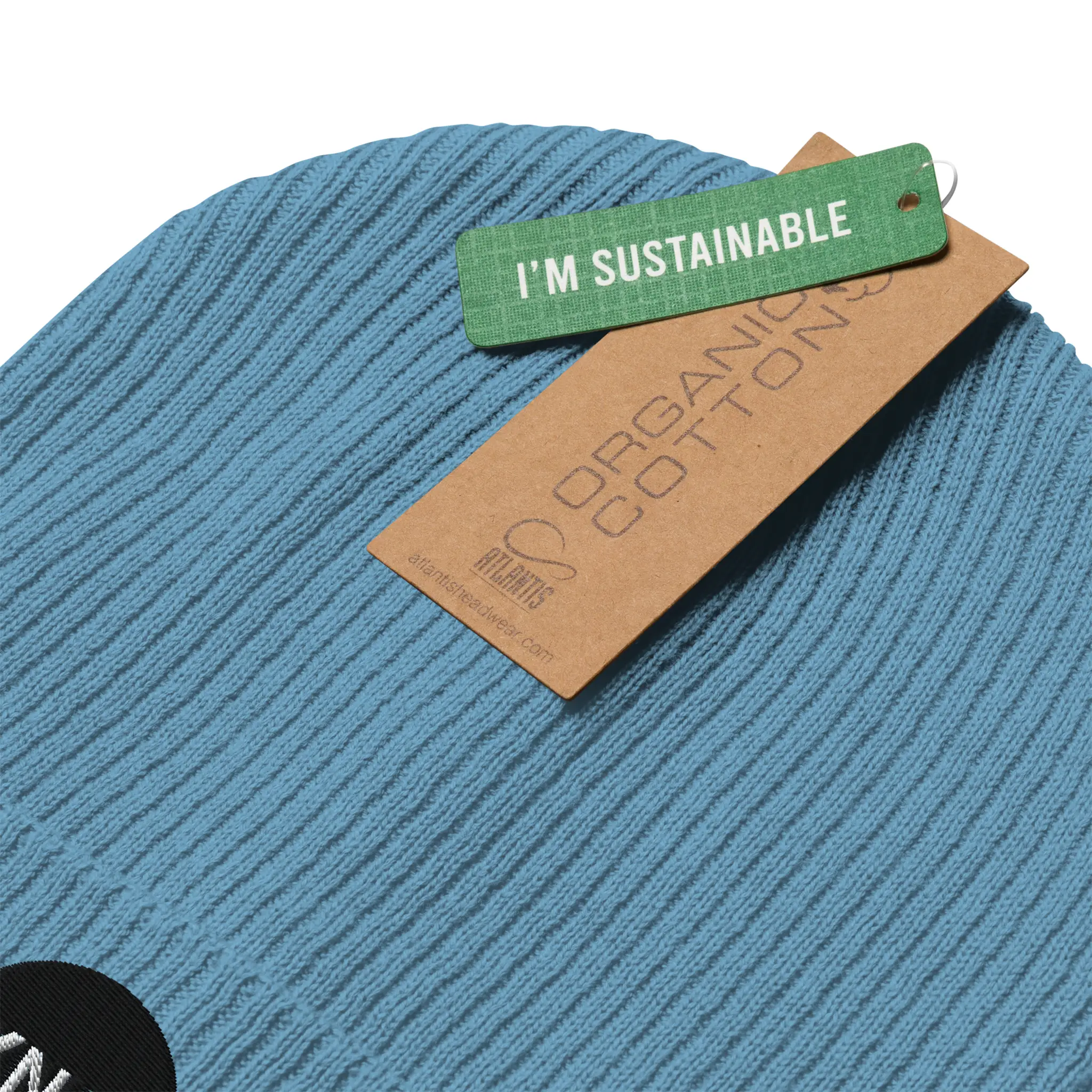 IXNAY Original Logo 100% organic ribbed beanie light blue sustainable certification tag detail view
