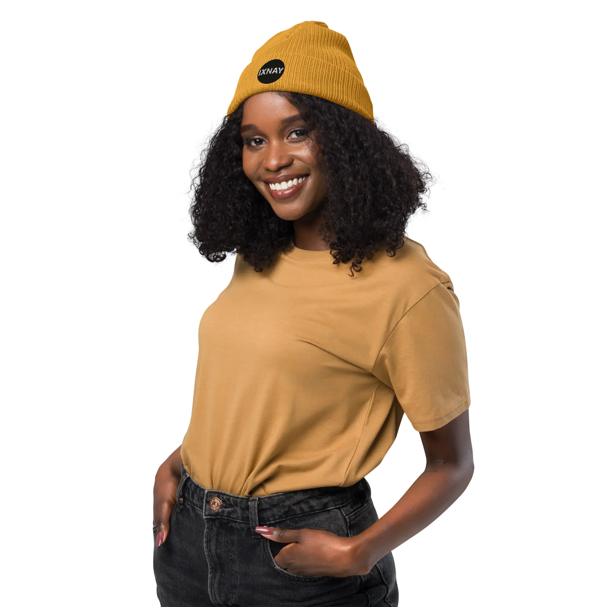 Woman wearing the IXNAY Original Logo 100% organic ribbed beanie in mustard yellow