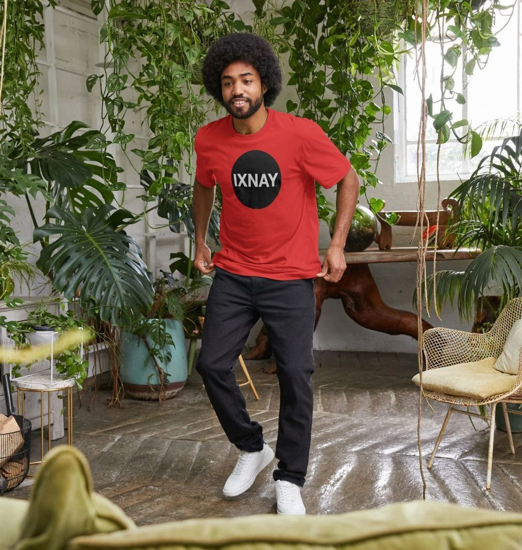 A man models a red t-shirt with a black circular logo that reads 'IXNAY' on the front.