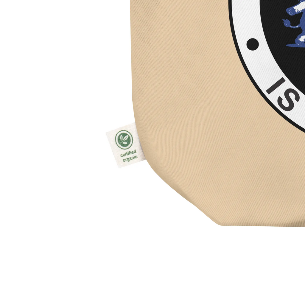 Oyster beige organic cotton tote bag with IXNAY's The Lesser of Evil is Still Evil graphic detail shot of certified organic tag.