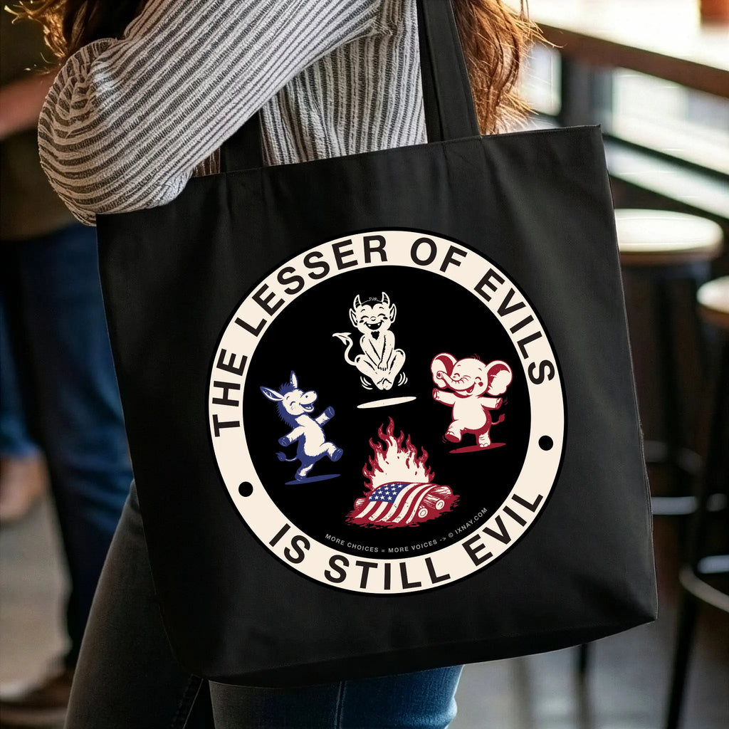 Woman holding black organic cotton tote bag with IXNAY's The Lesser of Evil is Still Evil graphic on front panel.