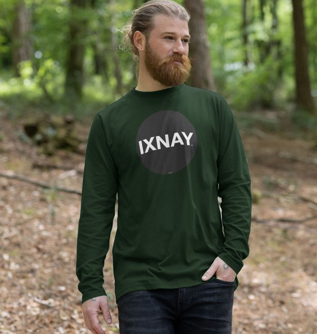 Man hiking in forest wearing Evergreen Dark Green Printed Men's Long-sleeved T-Shirt with Original Black Round IXNAY Logo from the artist and musician IXNAY