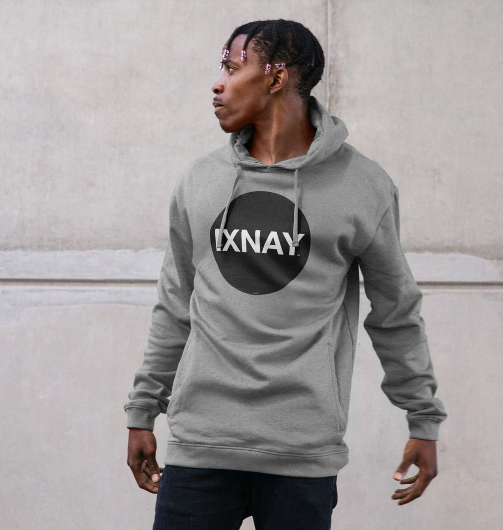 Black man in urban concrete structure wearing mens light heather gray organic cotton pullover hoodie with original black round IXNAY logo