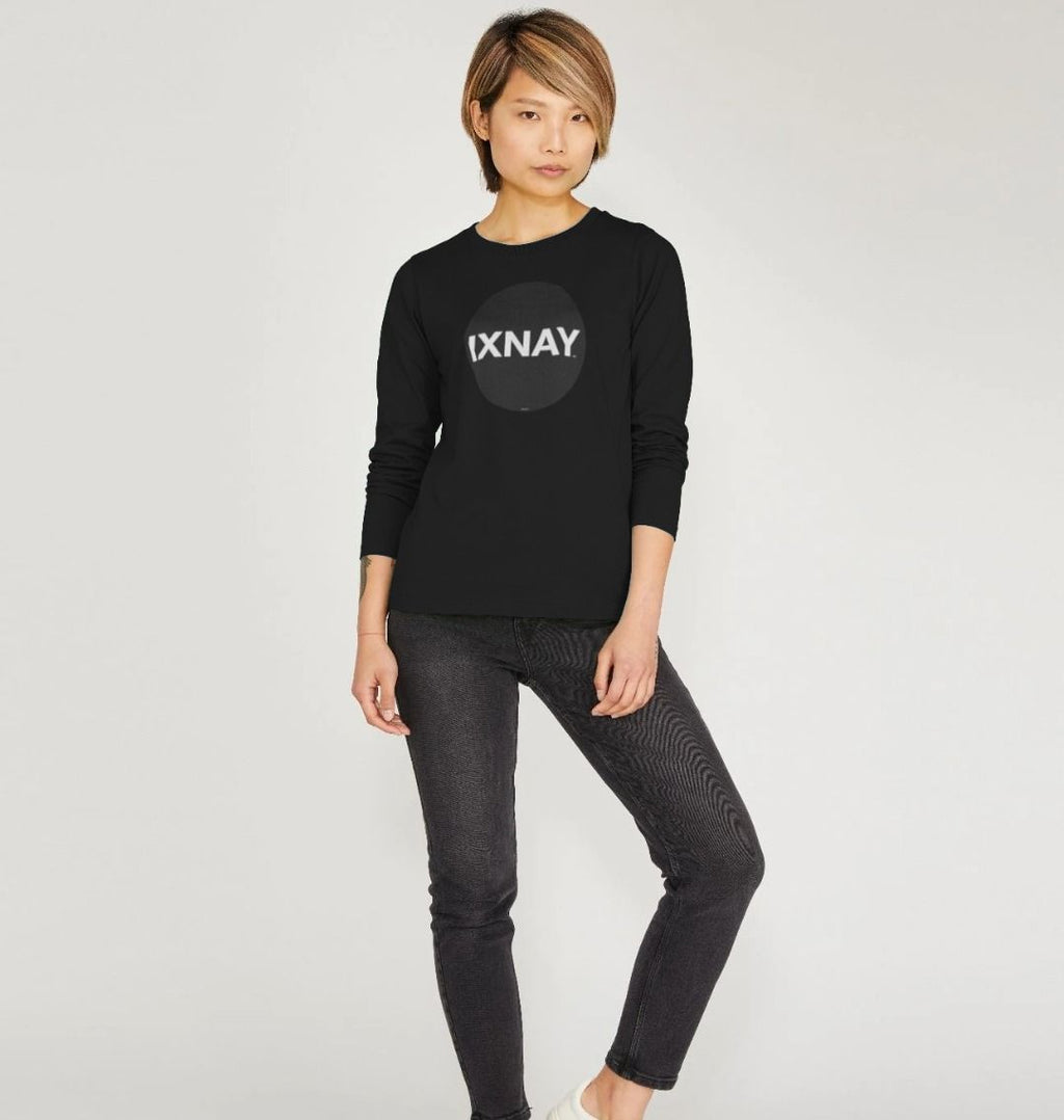 Beautiful Asian woman standing in front of all white studio backdrop wearing Printed Women's Long-sleeved T-Shirt with Original Black Round IXNAY Logo from the artist and musician IXNAY