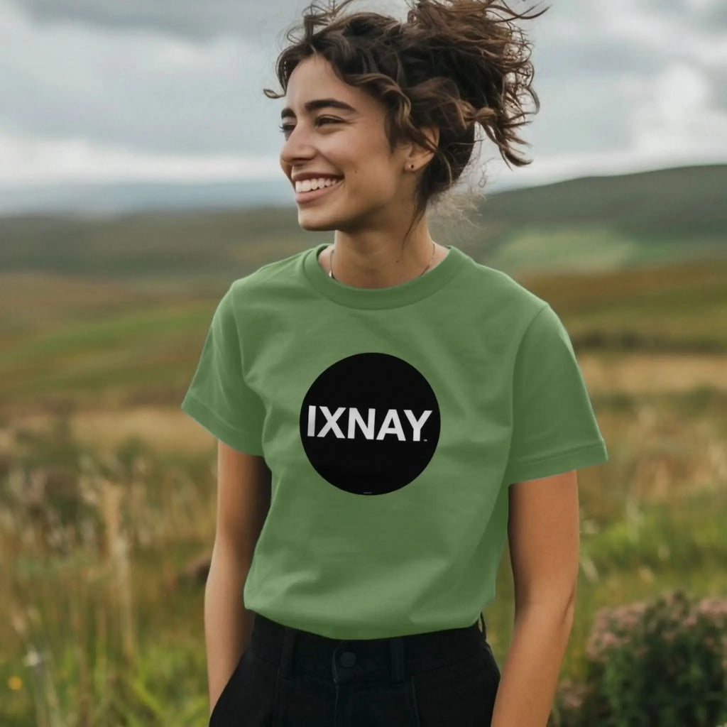 Woman wearing women's short-sleeve sage green t-shirt with 'IXNAY' original black circle logo in 100% organic cotton.
