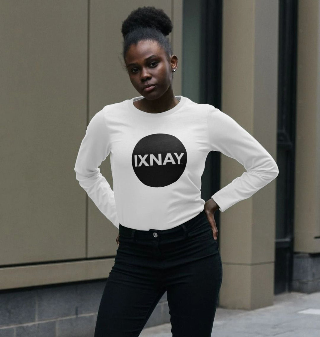 Beautiful black woman in urban setting wearing white Printed Women's Long-sleeved T-Shirt with Original Black Round IXNAY Logo from the artist and musician IXNAY