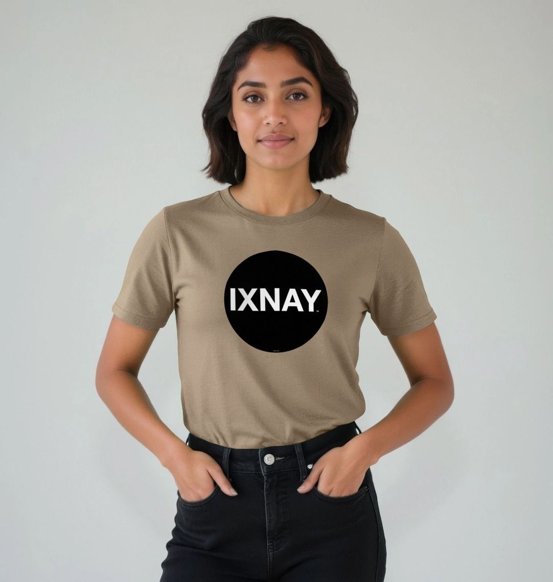 Woman smiling and standing in front of an all white background wearing Willow Beige Printed Women's T-Shirt with Original Black Circular IXNAY Logo