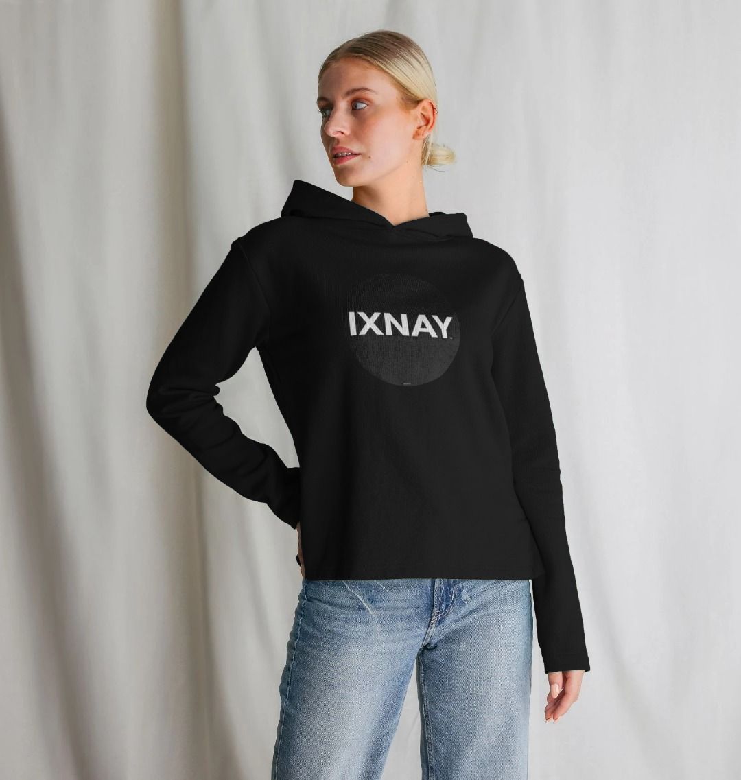 woman  posing with hand on hip wearing womens black organic remill pullover hoodie with original black round IXNAY logo